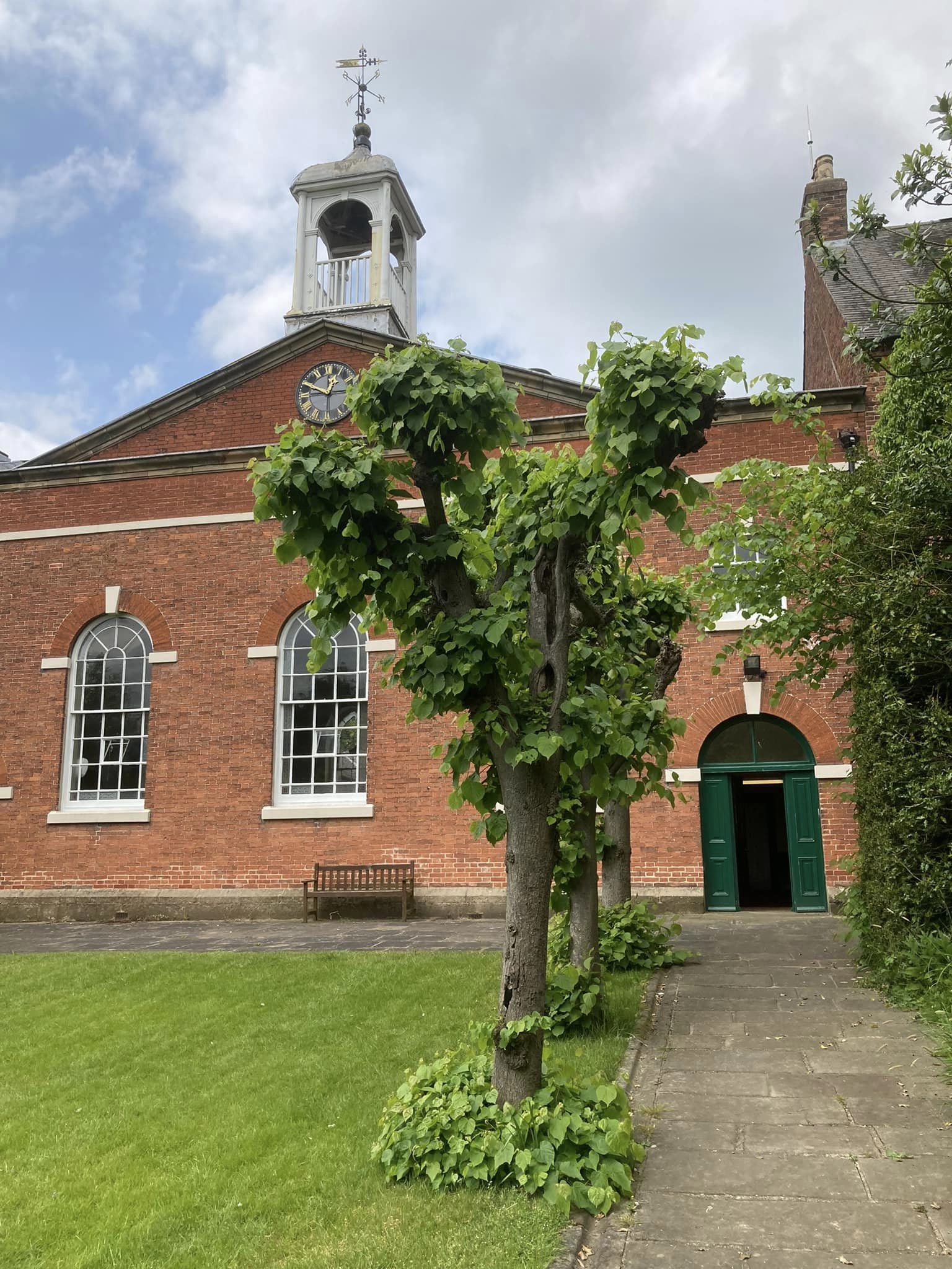 The red-brick chapel and white cupola at the Ockbrook Moravian Settlement